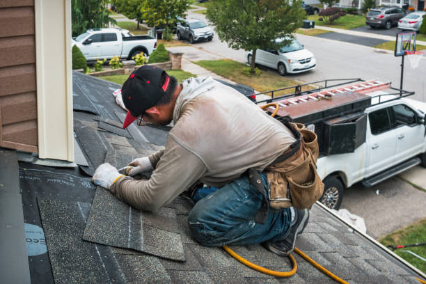 Professional Roofing technician working in Arlington, IA